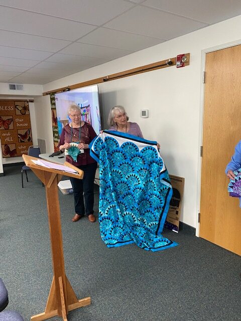 Pat Laub show off her completed quilt from her sea shell class she took last month! Well done!